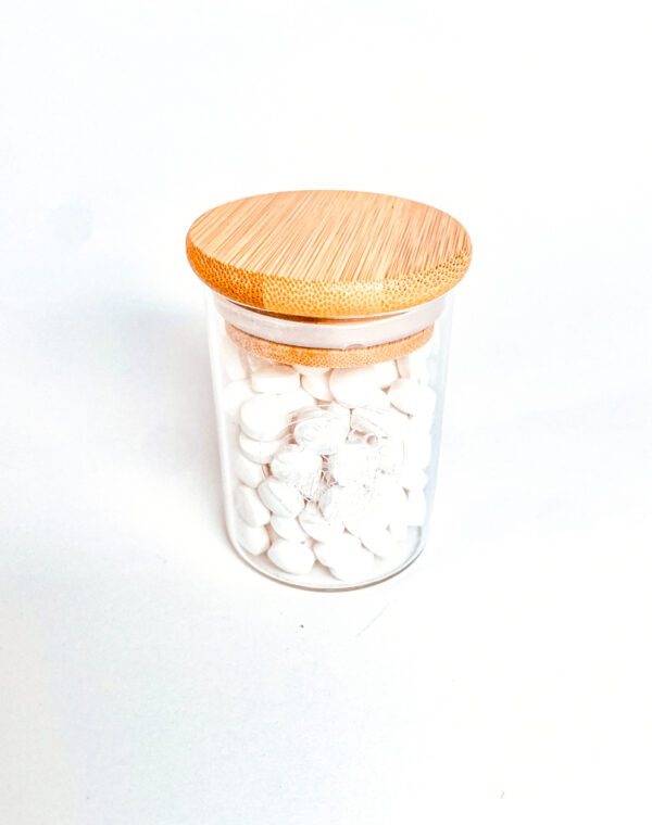 glass jar with toothpaste tabs